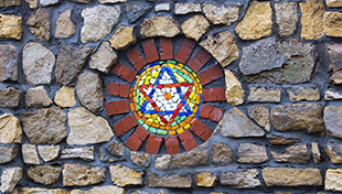 Star of David against brick wall